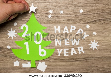  Applique with sign and New Year tree, cutted out of paper.