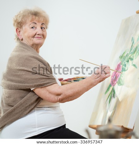 Senior woman during painting
