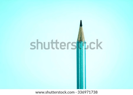 still life lighting with close up the top silver pencil on the blue gradient background