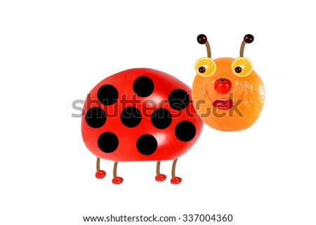 Creative food concept. Funny little  ladybird made from fruit and vegetables