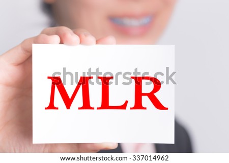 MLR (Minimum Loan Rate), message on the card show by businesswoman