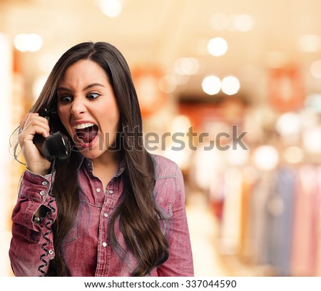 stressed young woman with telephone