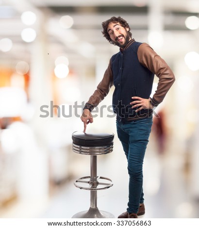 happy young man with bar stool