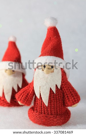Funny Santa Claus on winter background