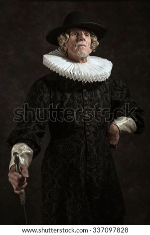 Official portrait of historical governor from the golden age. Standing with sword. Studio shot against dark wall.
