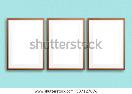  Blank photo frames on  textured wallpaper,  mock up.