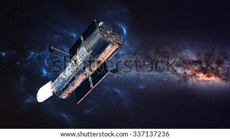 The Hubble Space Telescope in orbit above the Earth. Elements of this image furnished by NASA. Royalty-Free Stock Photo #337137236