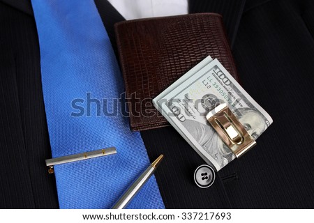 Tie, money in a clip on a suit with a shirt Royalty-Free Stock Photo #337217693