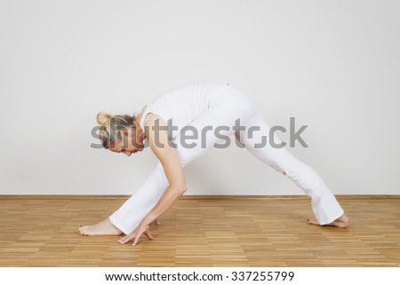 Woman praciticing yoga, Triangle Pose