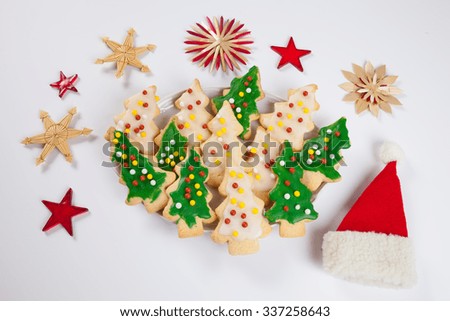 Christmas plate, Christmas cookies, Santa Claus hat and straw stars