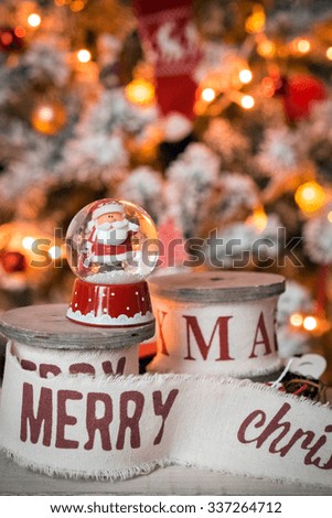 Little snow ball with Santa at christmas tree background