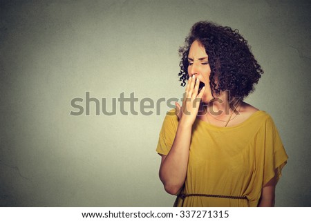 It is too early for meeting. Closeup portrait sleepy young woman with wide open mouth yawning eyes closed looking bored isolated grey wall background. Face expression emotion body language Royalty-Free Stock Photo #337271315