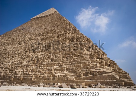 The Pyramid of Khafrae is the second largest of the Ancient Egyptian Pyramids of Giza and the tomb of the fourth-dynasty pharaoh Khafre (Chephren in Greek). Royalty-Free Stock Photo #33729220