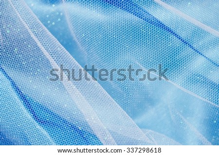 A close up photo of fabric clothing netting