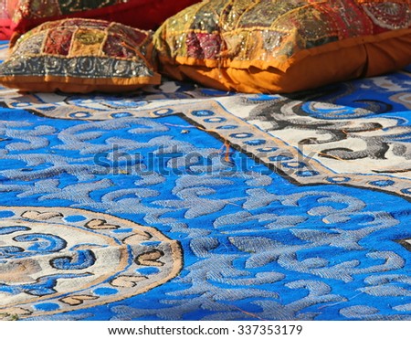 pillows and precious carpets in a harem Arabic