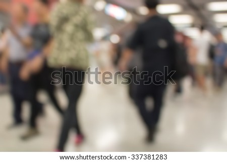 Blurred defocused abstract background of people walking