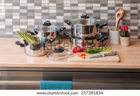 steel cookware set with modern kitchen Royalty-Free Stock Photo #337385834