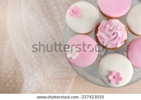 Tasty cupcake on stand, close-up