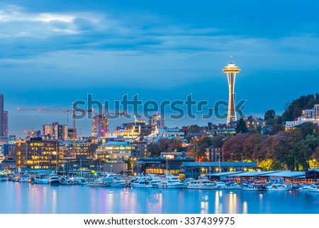 scenic view of beautiful Seattle Skylines with light reflection on Lake Union in blue hour. 