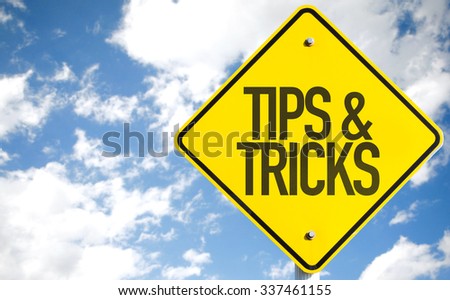 Tips & Tricks sign with sky background