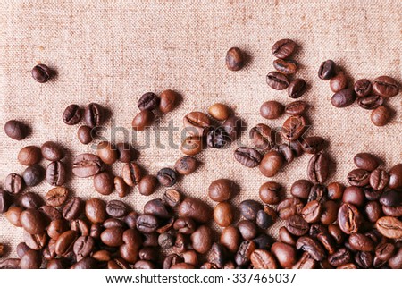 Roasted coffee beans on the linen fabric