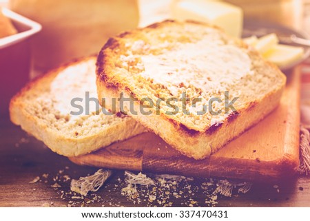 Toasted slices of freshly baked sourdough bread with butter.