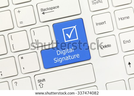 Close-up view on white conceptual keyboard - Digital Signature (blue key)