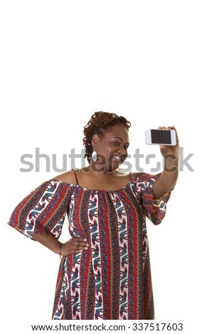 Middle aged woman hold a smart phone, taking a picture of herself, isolated on white
