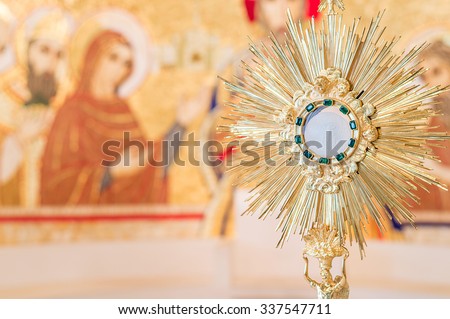 Rome, Italy - June 2015 - Adoration monstrance with the Blessed Sacrament on the altar with copy space for text Royalty-Free Stock Photo #337547711