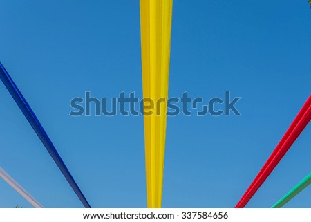 colorful festive fabric against a blue sky background