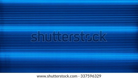 The blue light from the LED is abstract background. The blue stripes