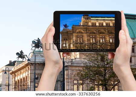 travel concept - tourist snapshot of State Opera House in Vienna on tablet pc