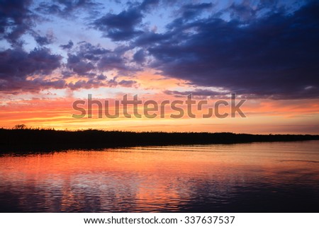 Sunset over water from "Delta del Po", Italian landscape. water and sky