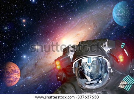 Astronaut et extraterrestrial alien spaceman helmet space solar system planet. Elements of this image furnished by NASA.