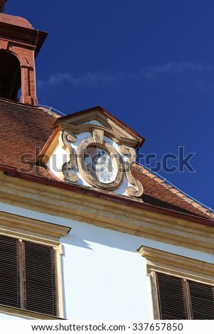 Eggenberg castle (Graz, Austria): architectural details of the roof with blue sky in the background.