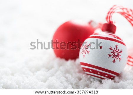Vintage Christmas ball on snow background, selective focus