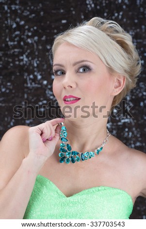Closeup portrait of adult woman beautiful face with perfect makeup and necklace