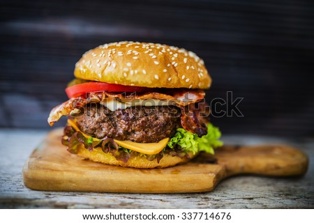 Homemade hamburger with fresh vegetables Royalty-Free Stock Photo #337714676