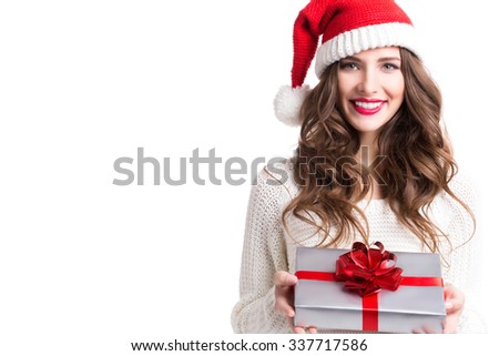 Cute woman holding a Christmas and New Year gifts.