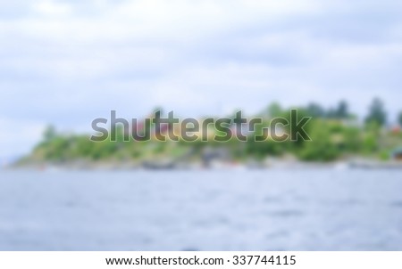 Defocused Background of the shore on the Oslo fjord in Norway. Intentionally blurred post production for bokeh effect