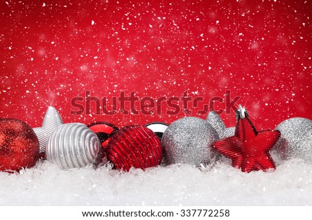 Christmas background with baubles in snow and copy space