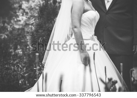 bride and groom outside in black and white closeup