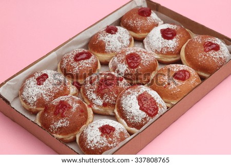 Fresh Hanukkah Donuts Isolated on pink background