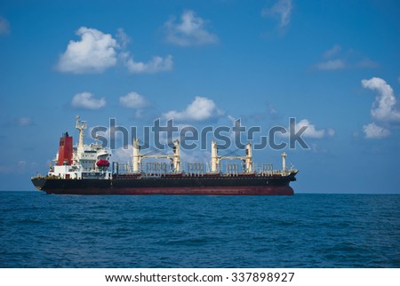A barge anchored in the Mediterranean sea outside the Haifa sea port. Import export international trade stock image.