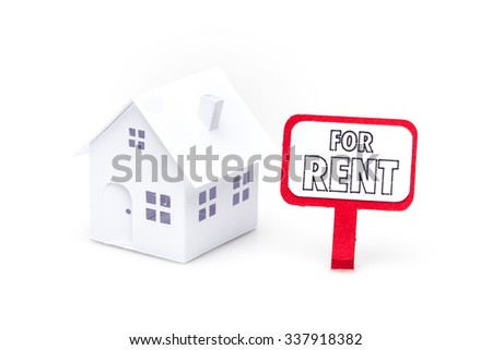 Little house made of paper isolated on white background with a sign for rent. Royalty-Free Stock Photo #337918382