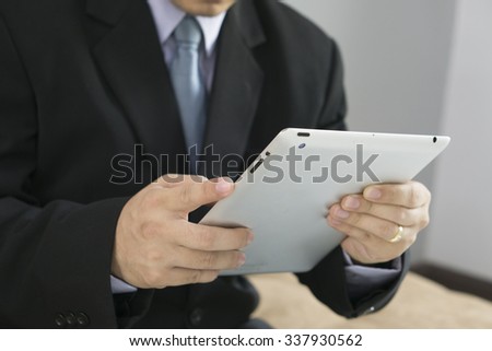 Asian Business man use tablet pc,selective focus.