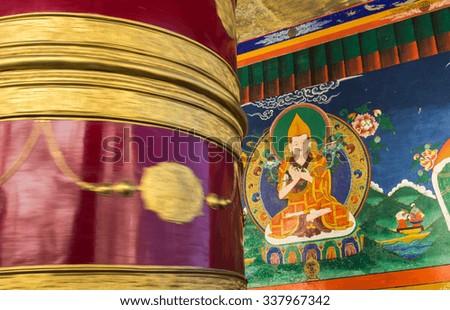 Mural of Buddha and motion of tibet bell