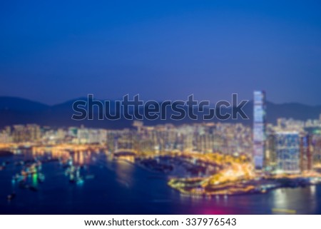 blur abstract city background,skyscraper of kowloon City Hong kong at Twilight view from The Peak.
