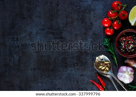 Vintage spoon and vegetables for cooking on dark metal background with space for text. Top view. Bio Healthy food ingredients.  Royalty-Free Stock Photo #337999796