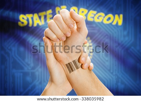 Barcode ID number tatoo on wrist and USA statesl flag on background - Oregon